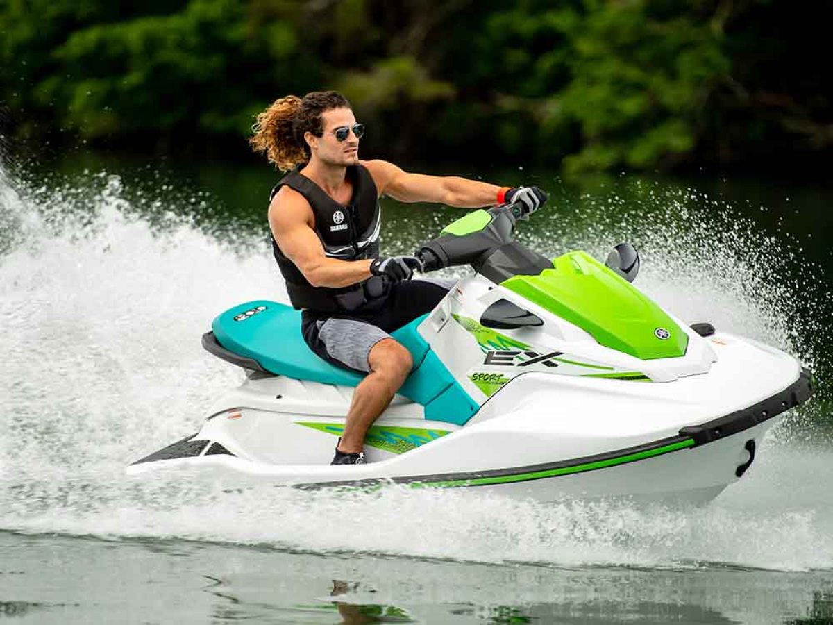 a person riding a surf board on a body of water